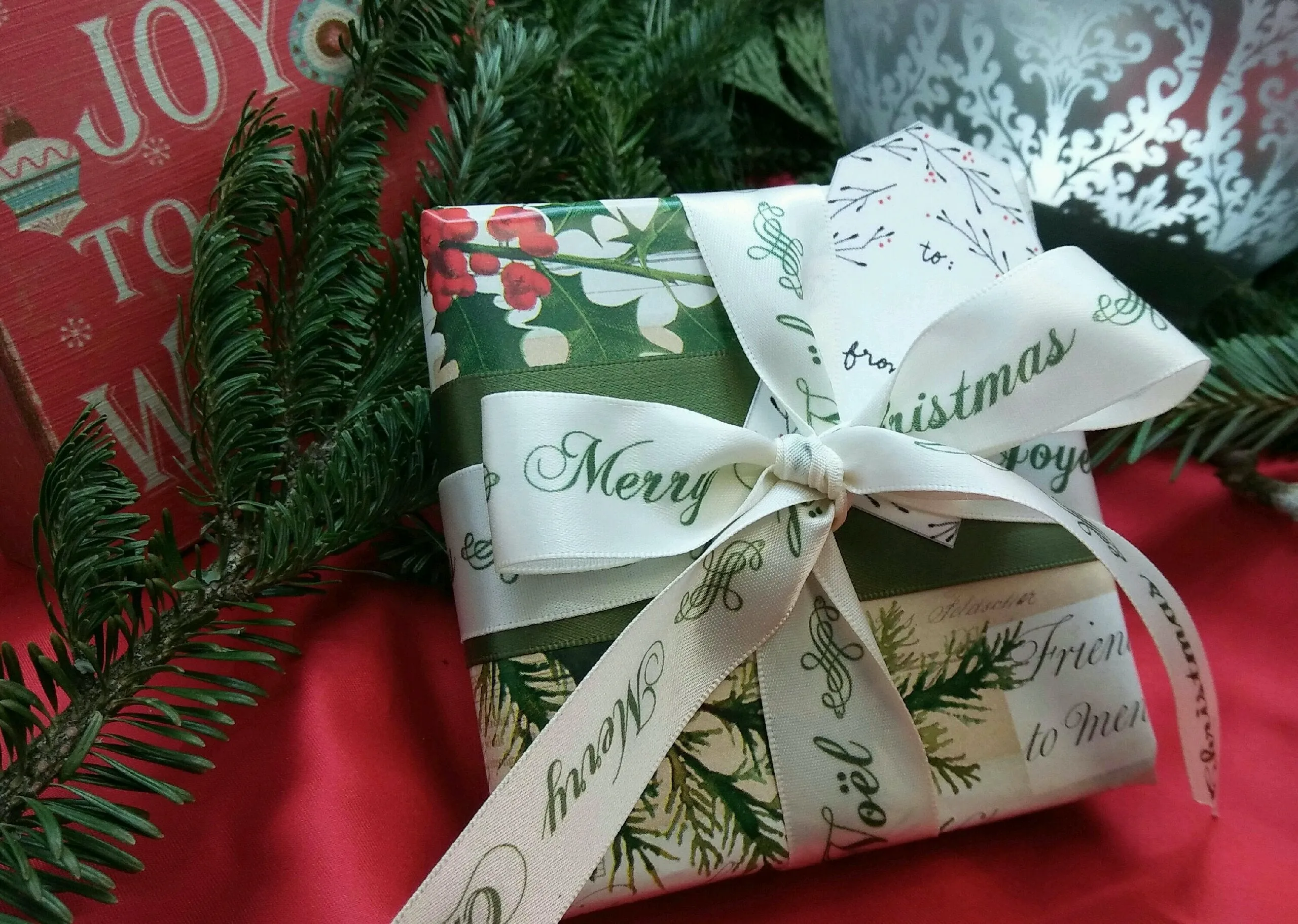 Joyeux Noel, Merry Christmas Ribbon in ruby red on 7/8" Antique White Single Face Satin ribbon