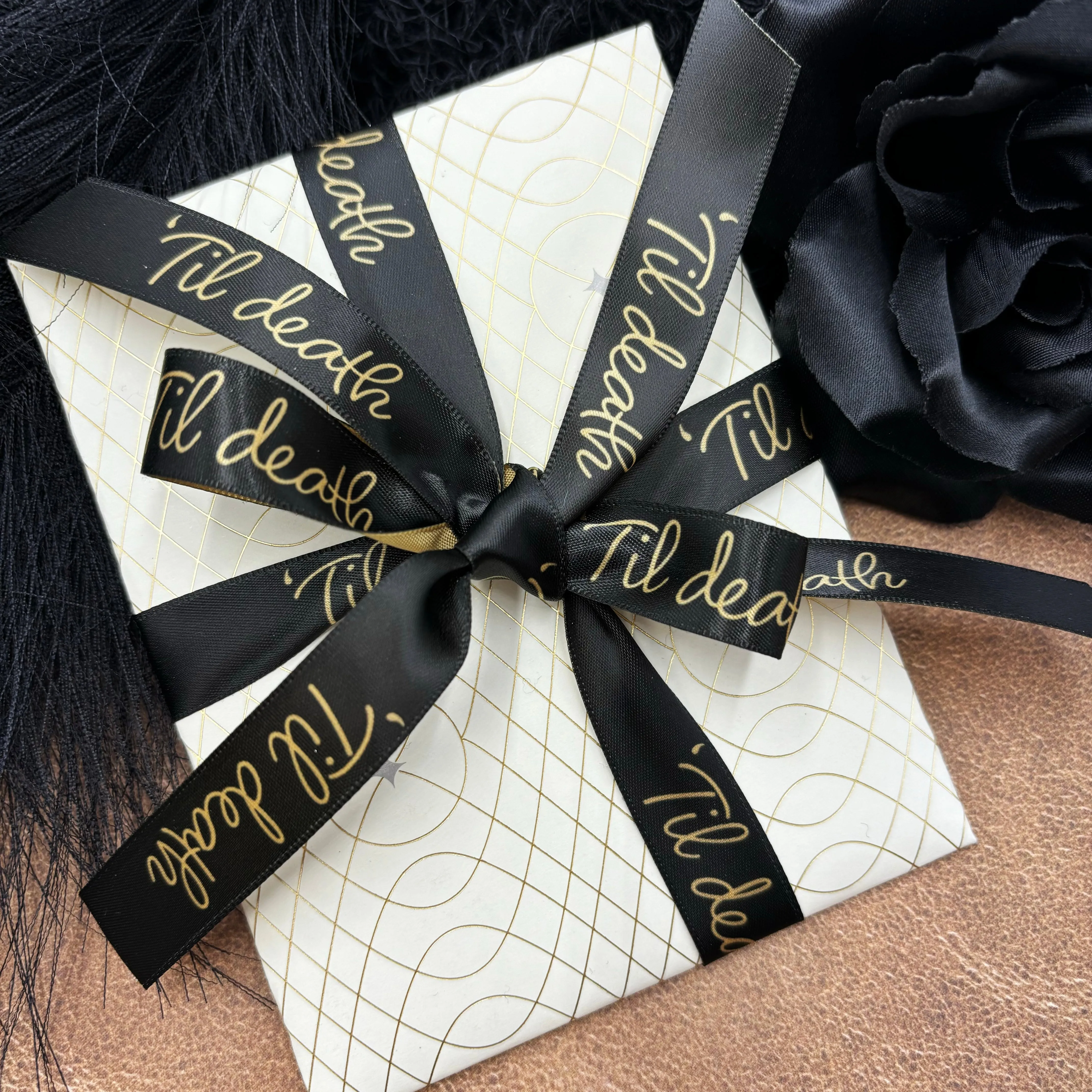 Til Death ribbon Til death in gold script on a black background printed on 5/8" dijon gold single face satin